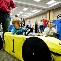 Ann Arbor resident Daniel Pritts, 4, plays in a race car game cockpit during the Mini Maker Faire on Saturday, June 8. Daniel Brenner I AnnArbor.com